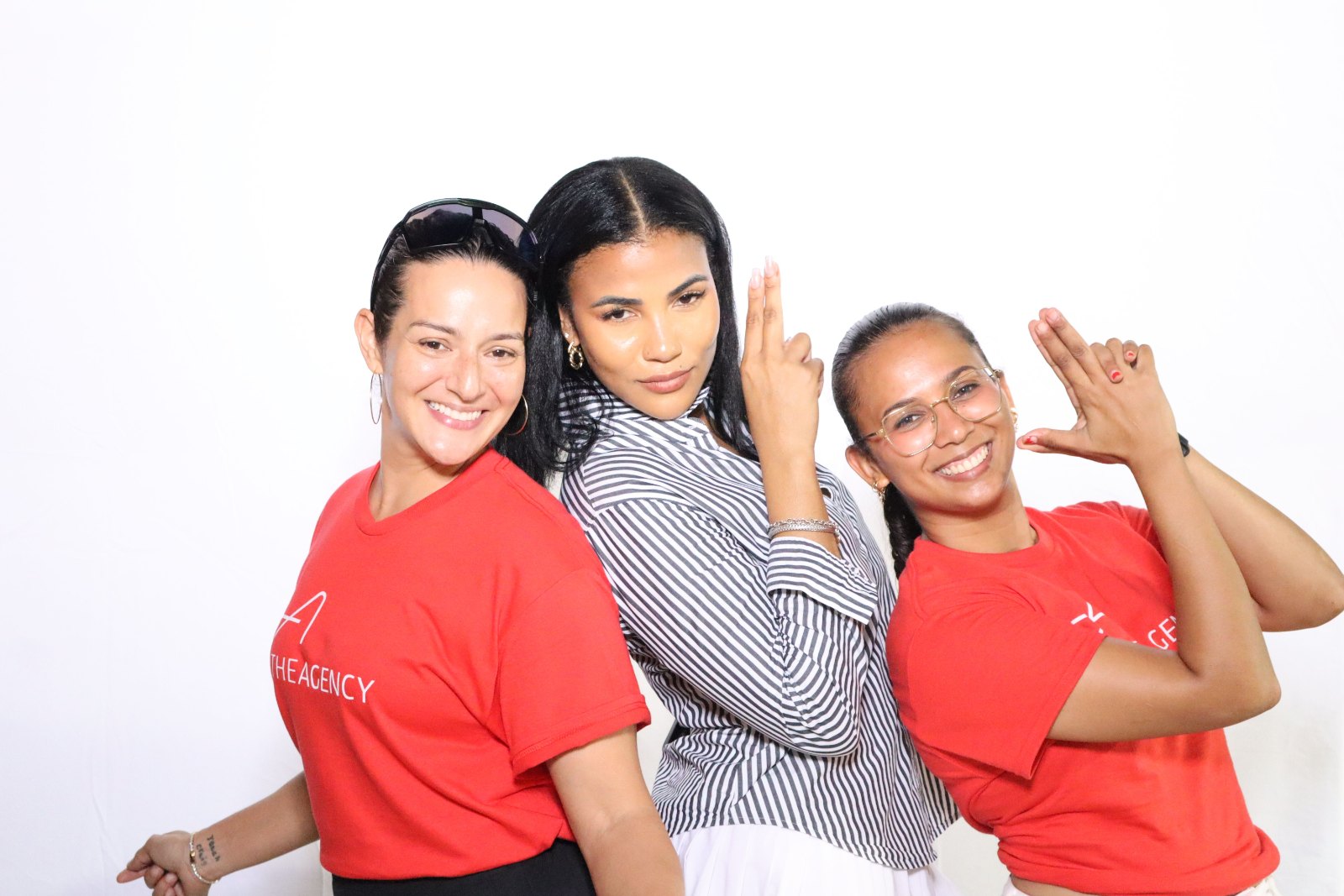 Three guests posing at a brand event