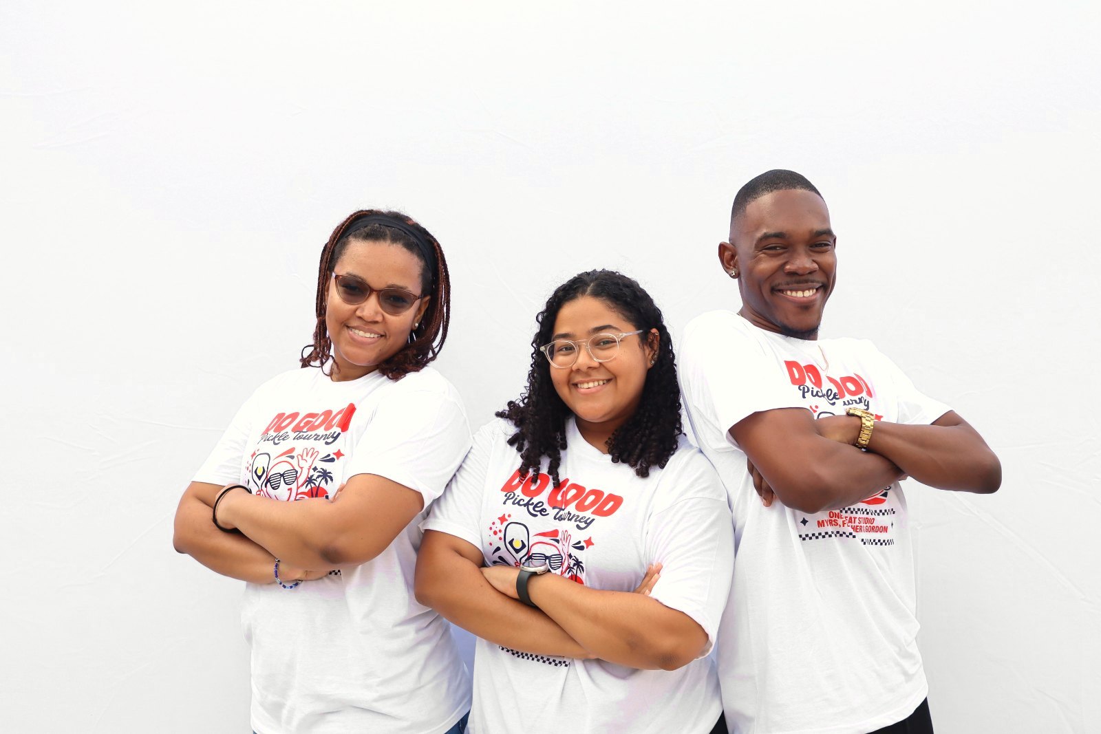 Three guests in matching event tees
